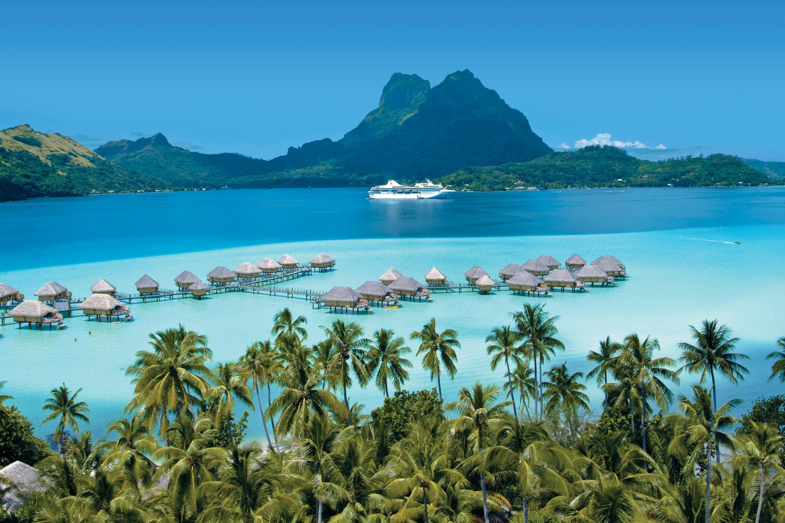 Bora Bora Overwater Bungalows, trees at bottom, from PG press site